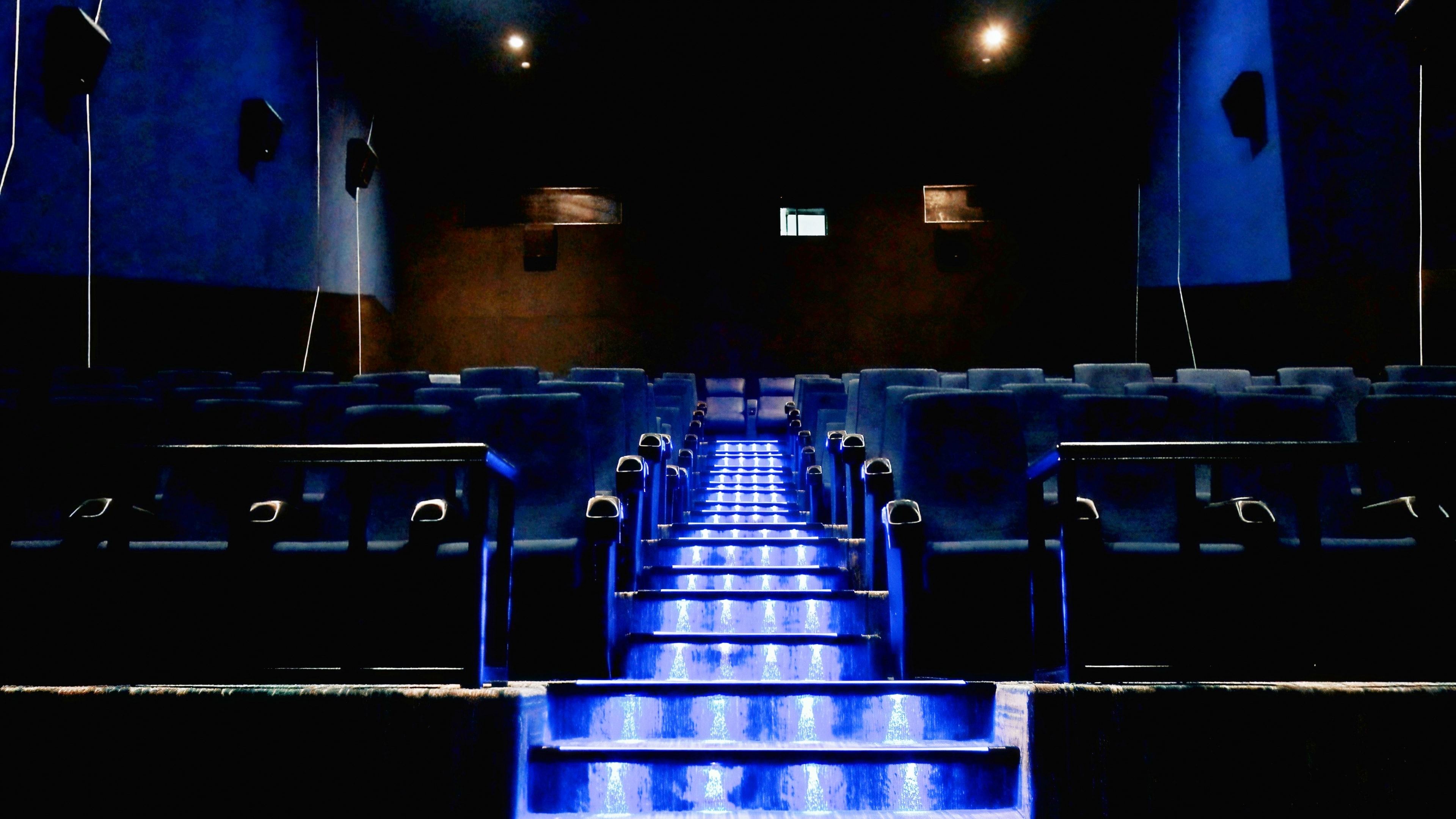 JP DD Cinemas Satna blue-lit auditorium seating